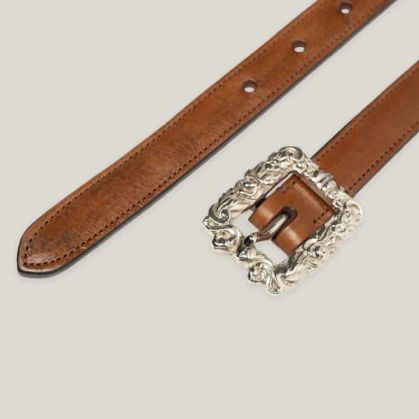 detail of narrow belt with antique buckle